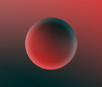 a red and black background with a round object in the center