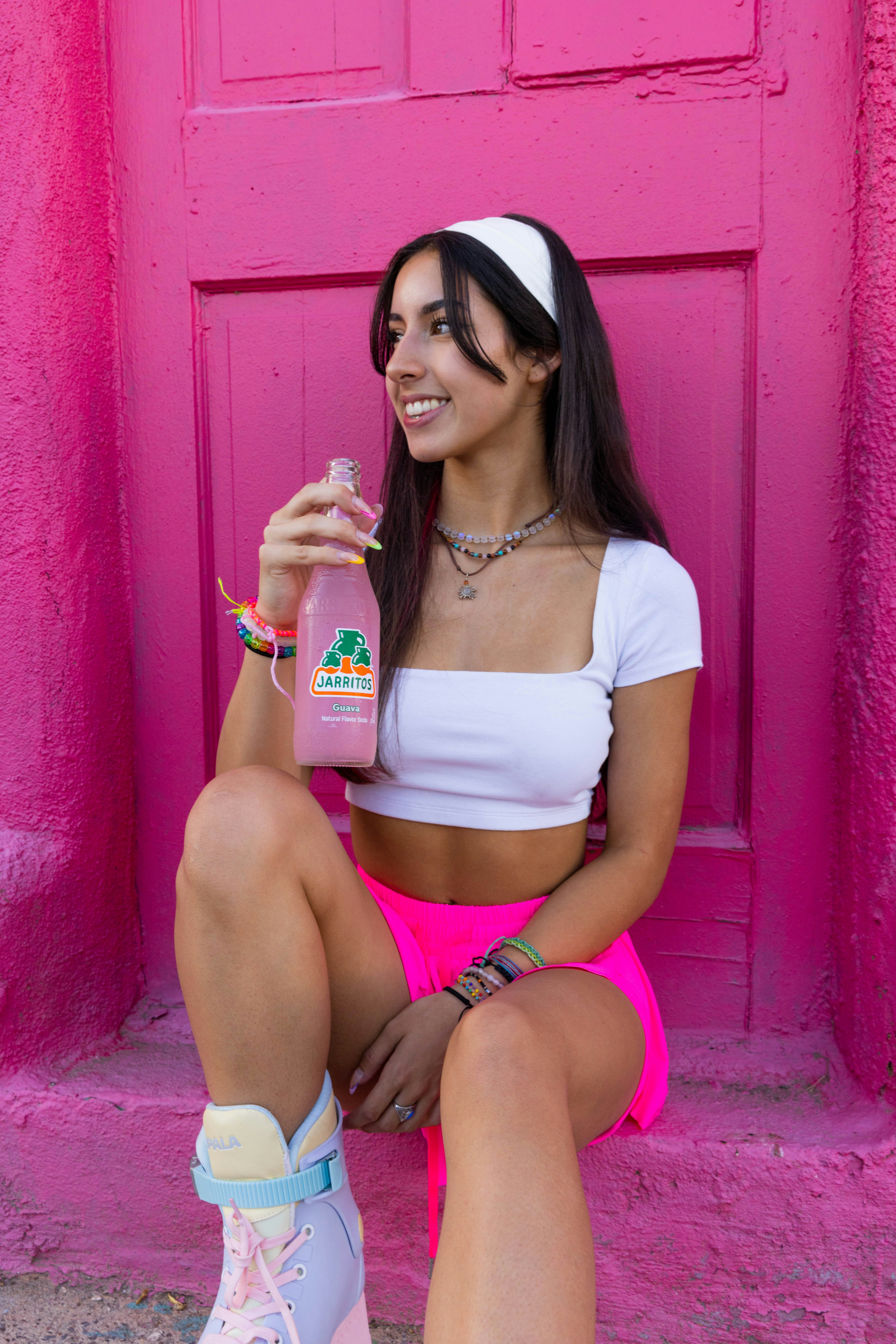 a woman rollerblading with 90s hair wearing a headband