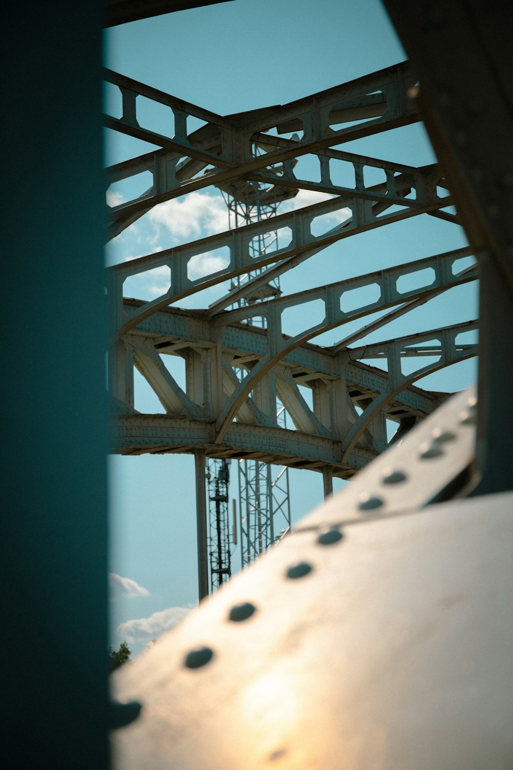 a view of a bridge with a sky in the background