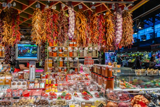 A vibrant market stall filled with colorful Mexican spices and fresh produce.