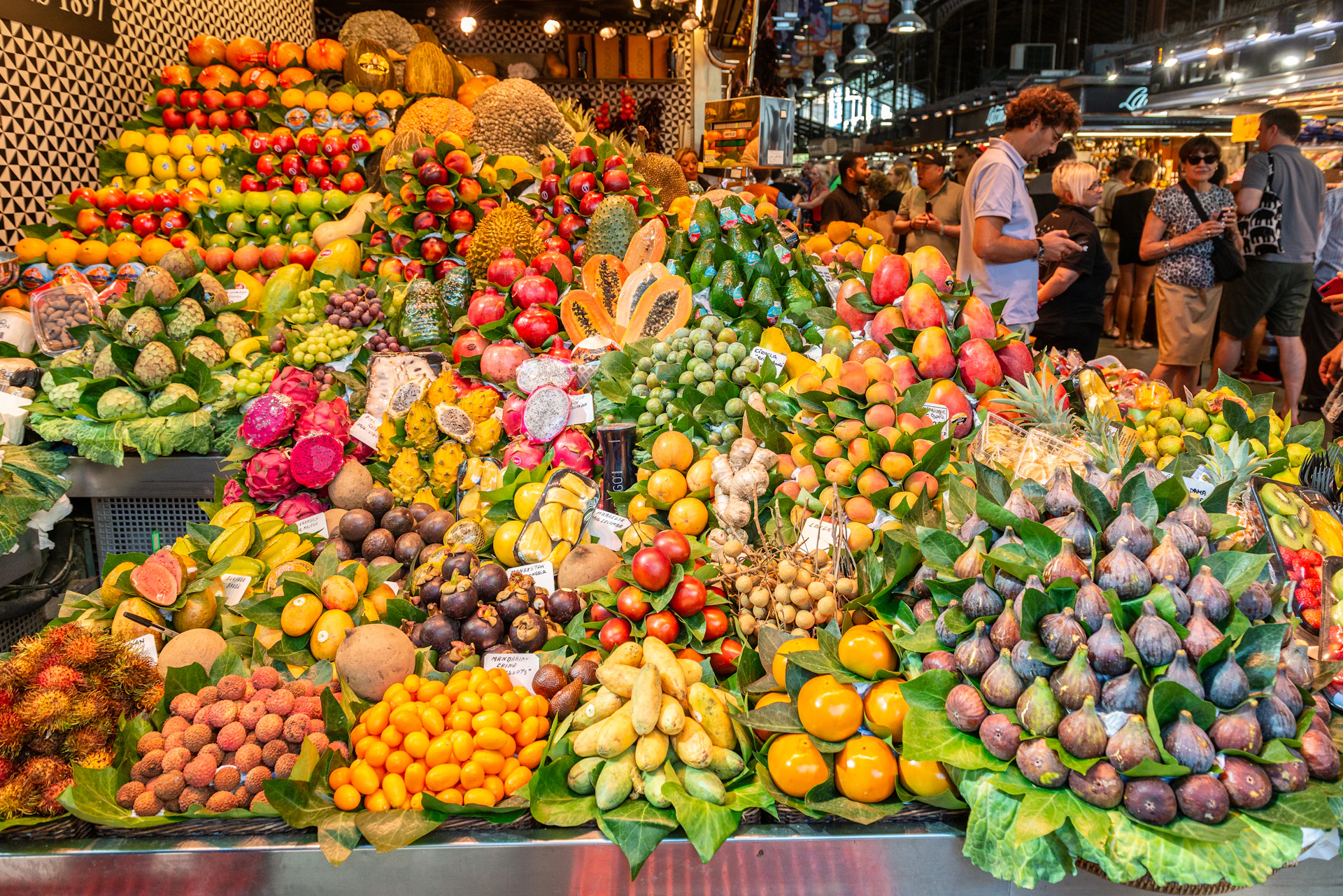 a large display of fruits and vegetables at a market