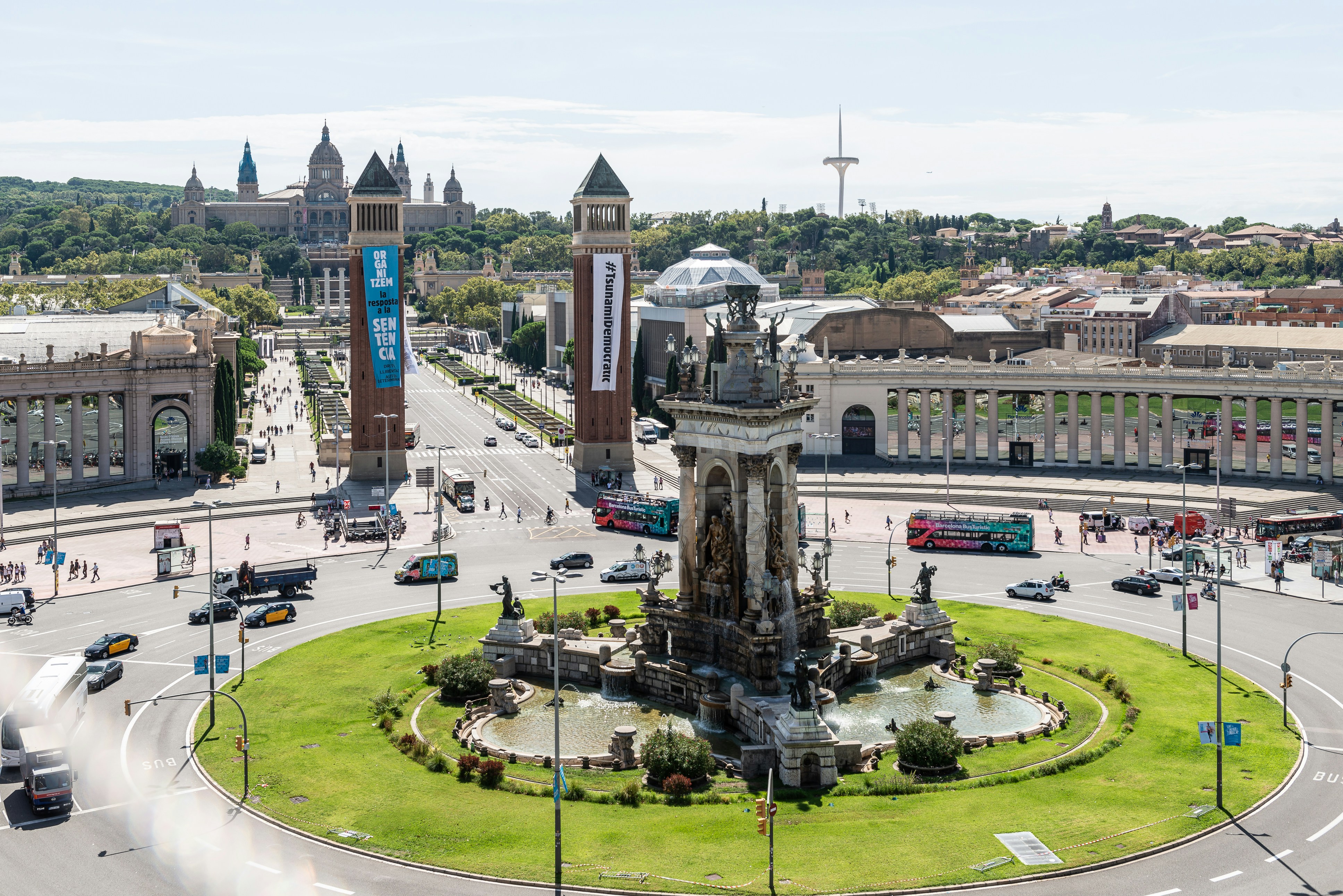 a large clock tower sitting in the middle of a city