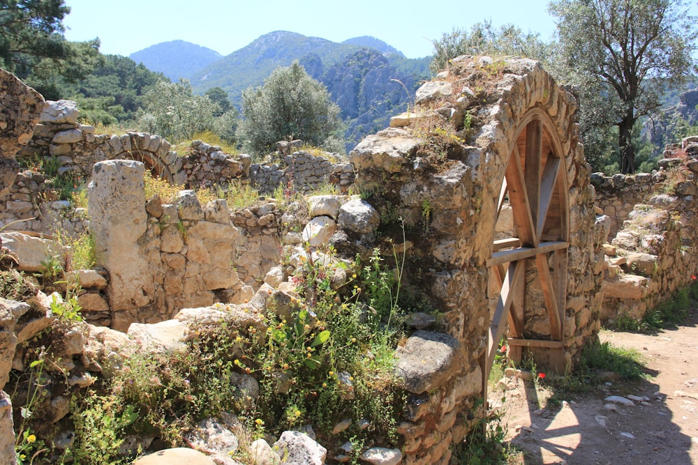 a stone building with a window in the middle of it