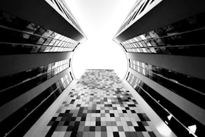 a black and white photo of a very tall building