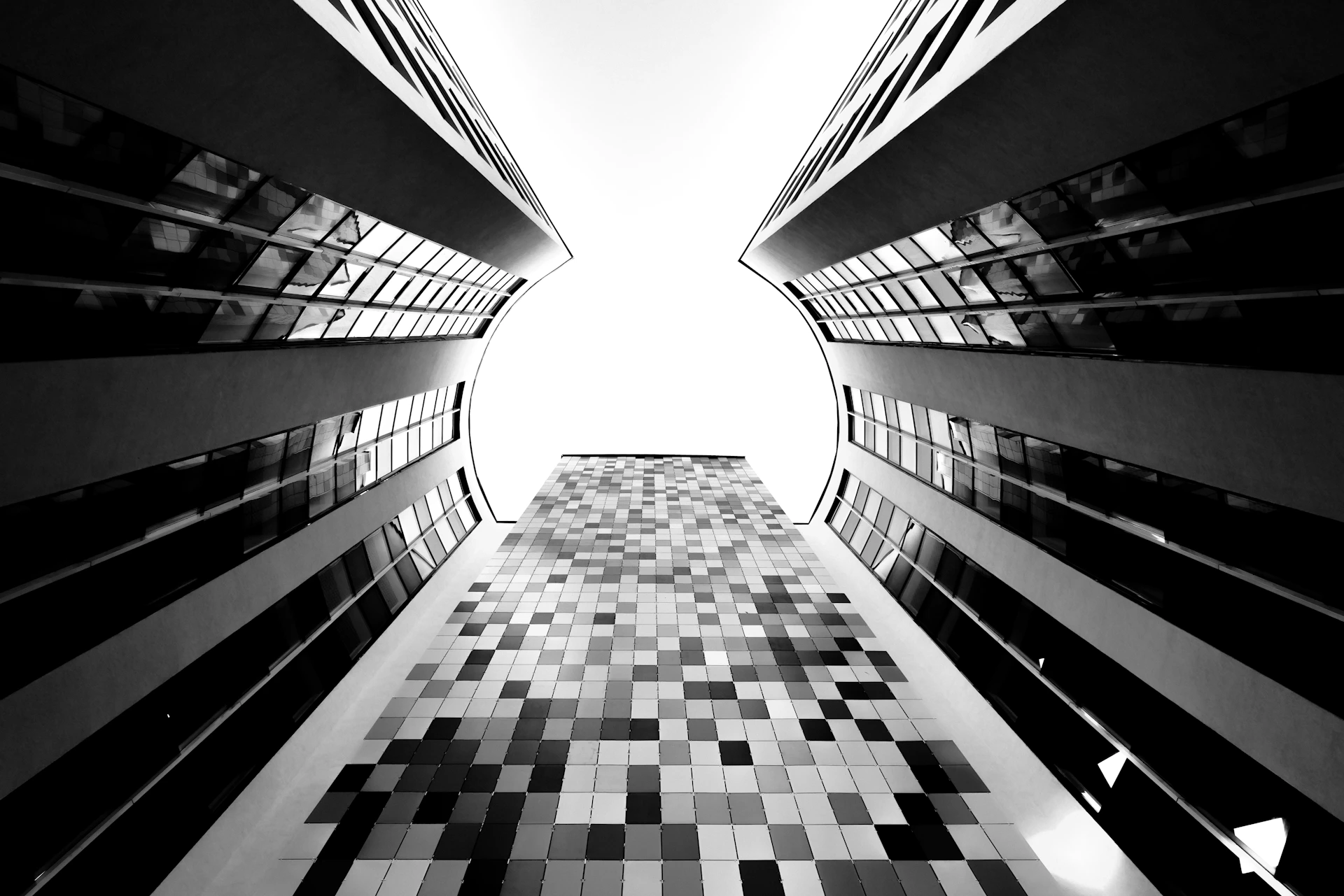 a black and white photo of a very tall building