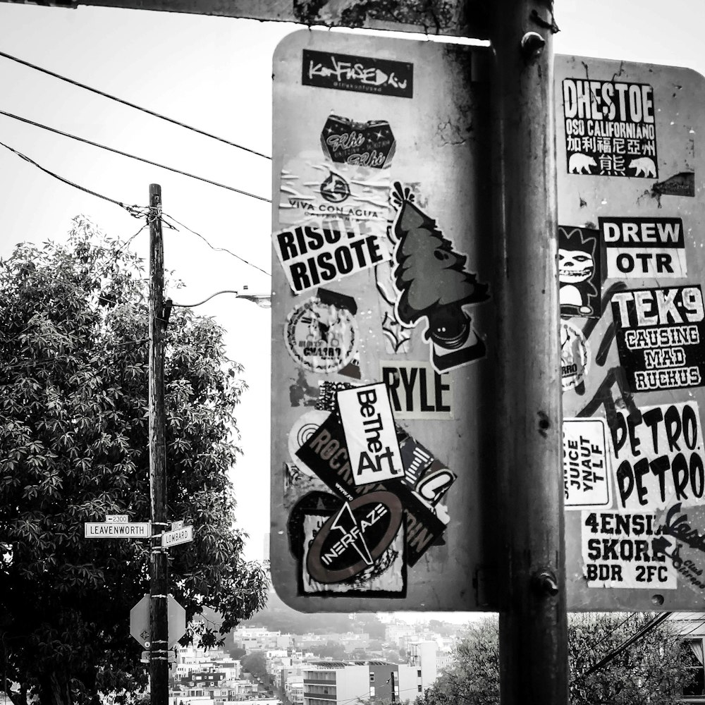 a pole with a bunch of stickers on it