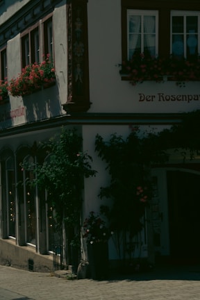 A charming fourplex exterior with fresh paint and well-kept landscaping on a sunny day