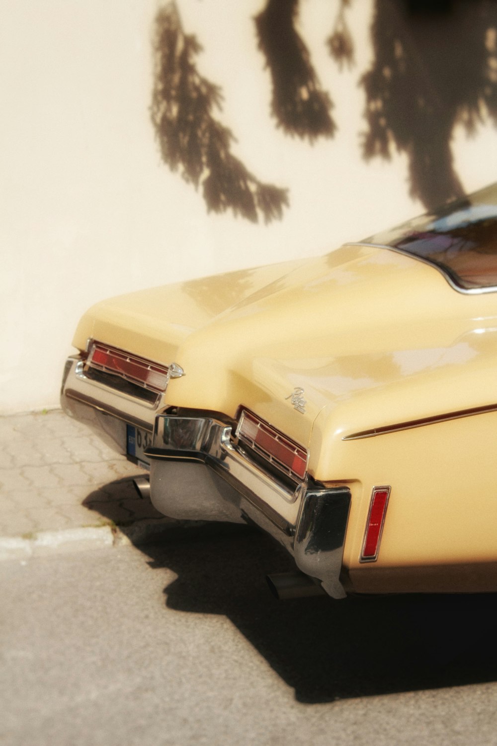 a yellow toy car parked on the side of the road