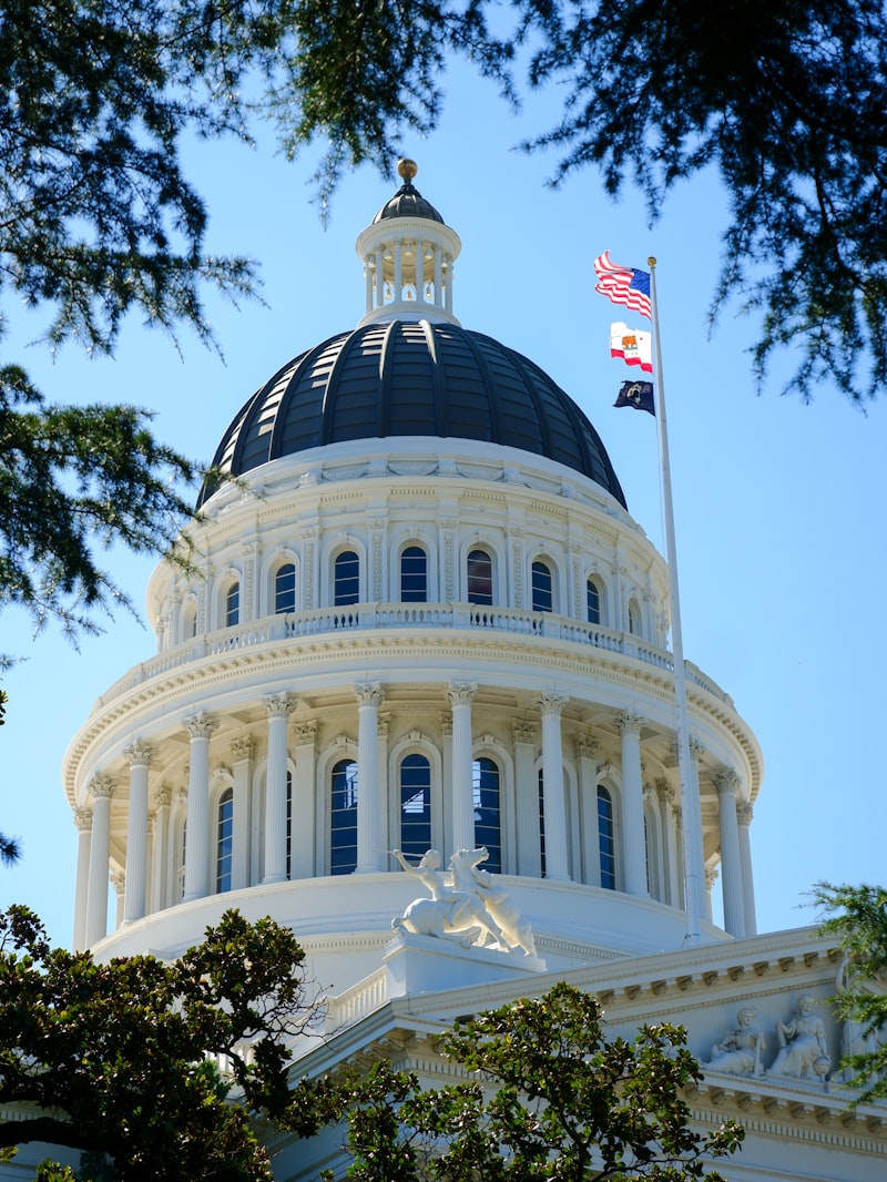 California State Capitol building with flag on top
