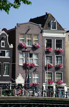 a bridge that has a bunch of flowers on it