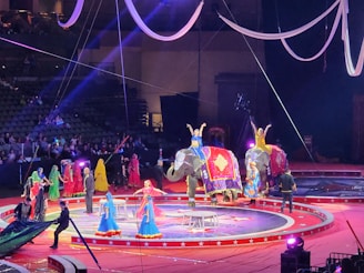 Colorful circus tent with playful animal characters performing under bright stars.