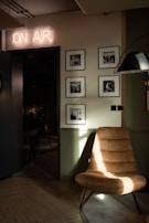 The radio studio's minimalist interior illuminated warmly during an evening broadcast.