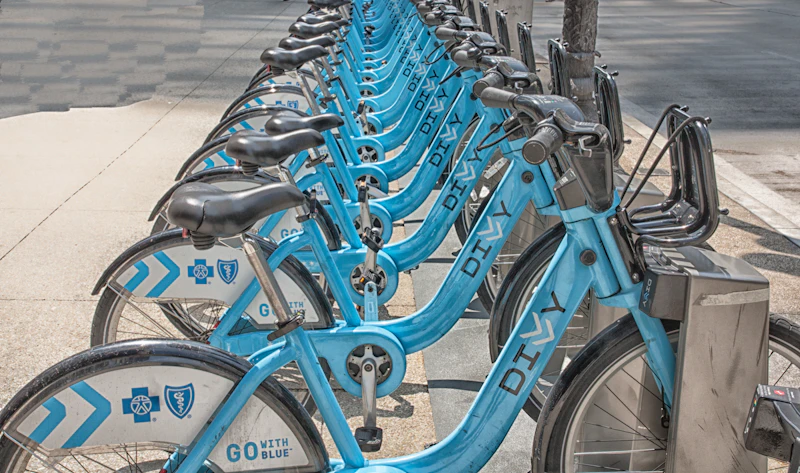 A row of blue Divvy bike-share bicycles docked at a Chicago station
