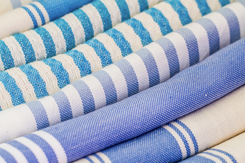 a group of blue and white striped fabrics