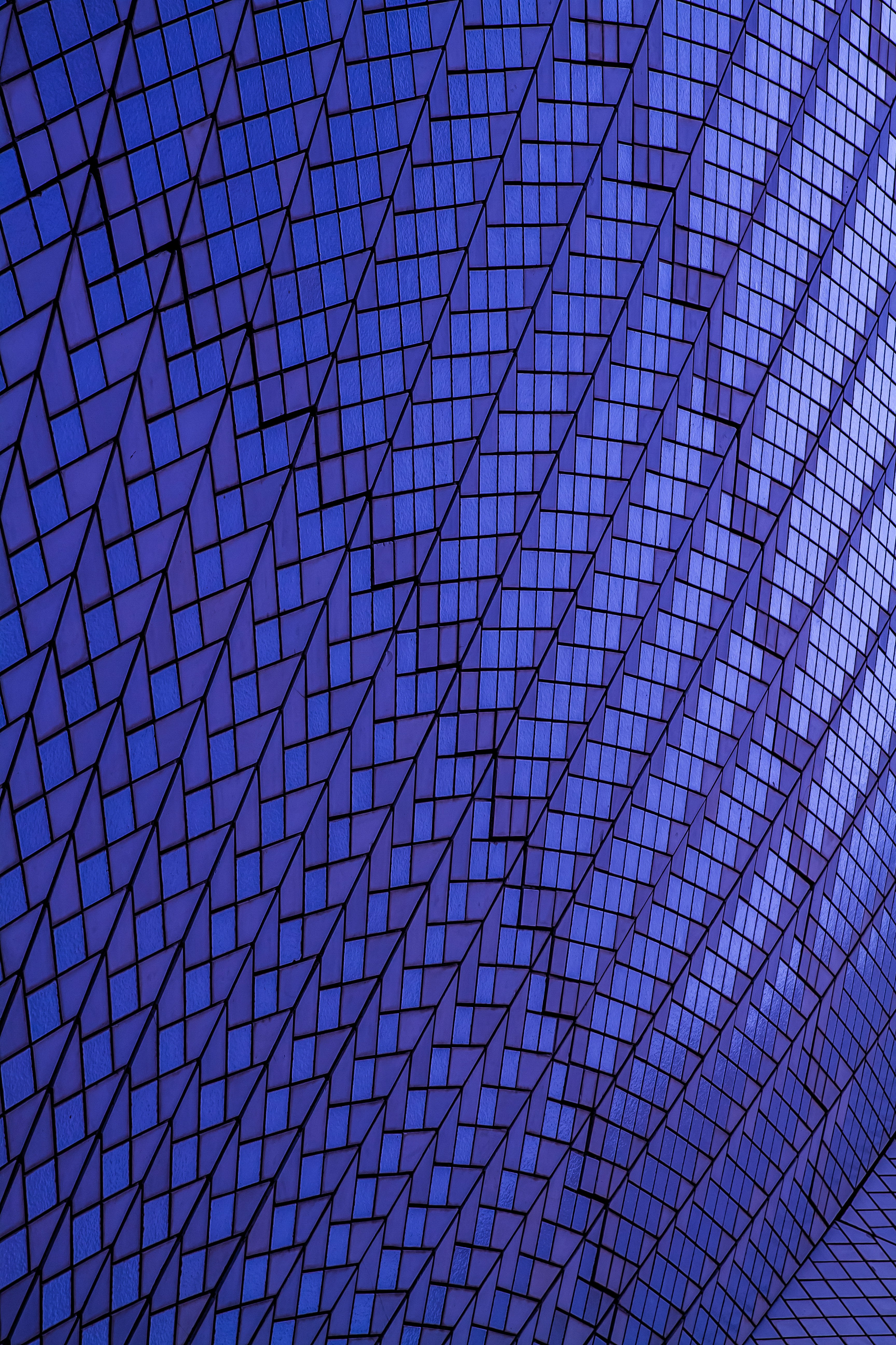 a very tall building with a blue sky in the background