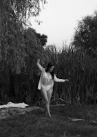 A natural outdoor setting with a model in a subtle, elegant bathing suit from Sutilia