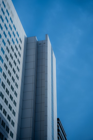 Minimalist architectural detail of a modern Nairobi high-rise building against a clear sky.