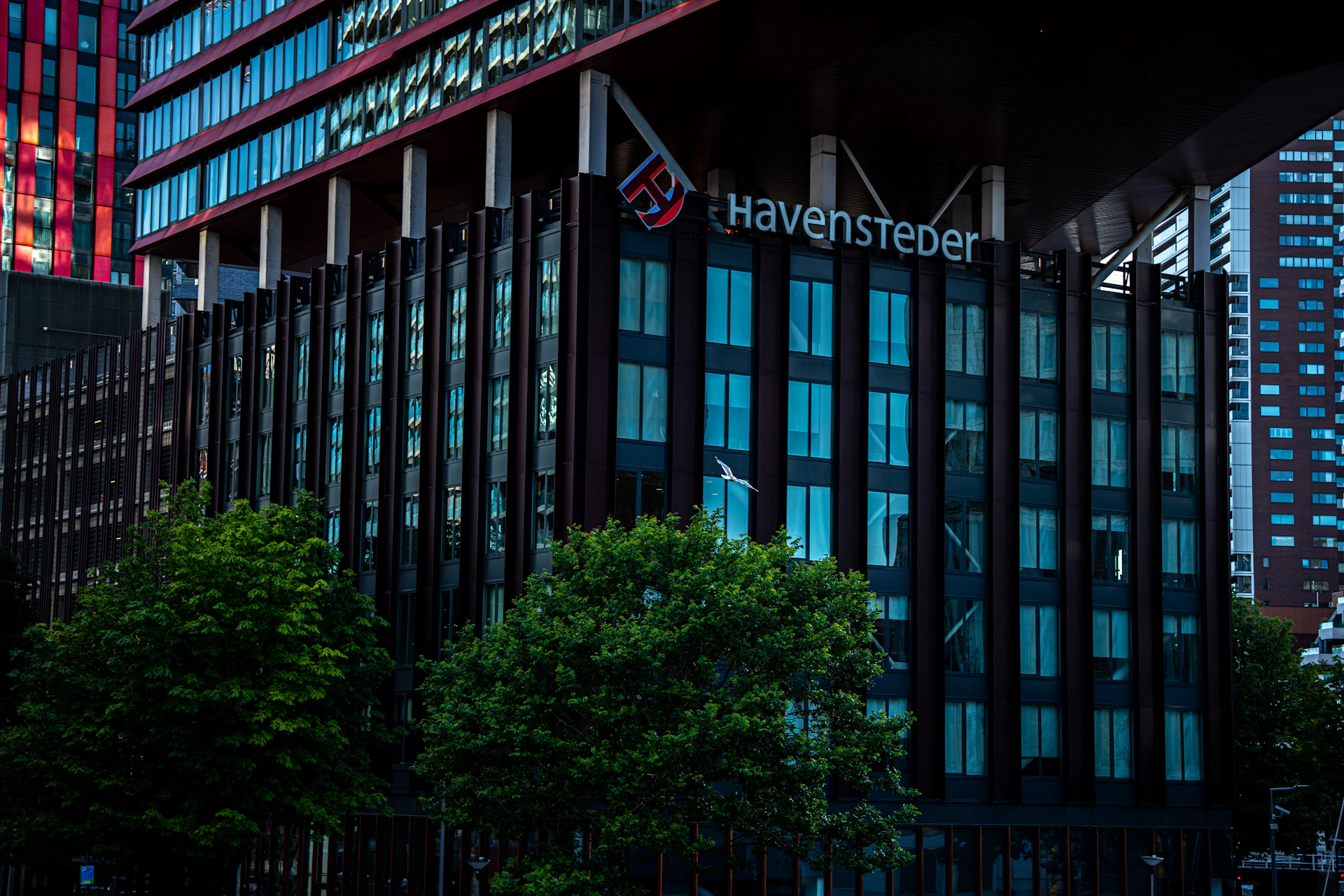 a very tall building with a sign on it's side