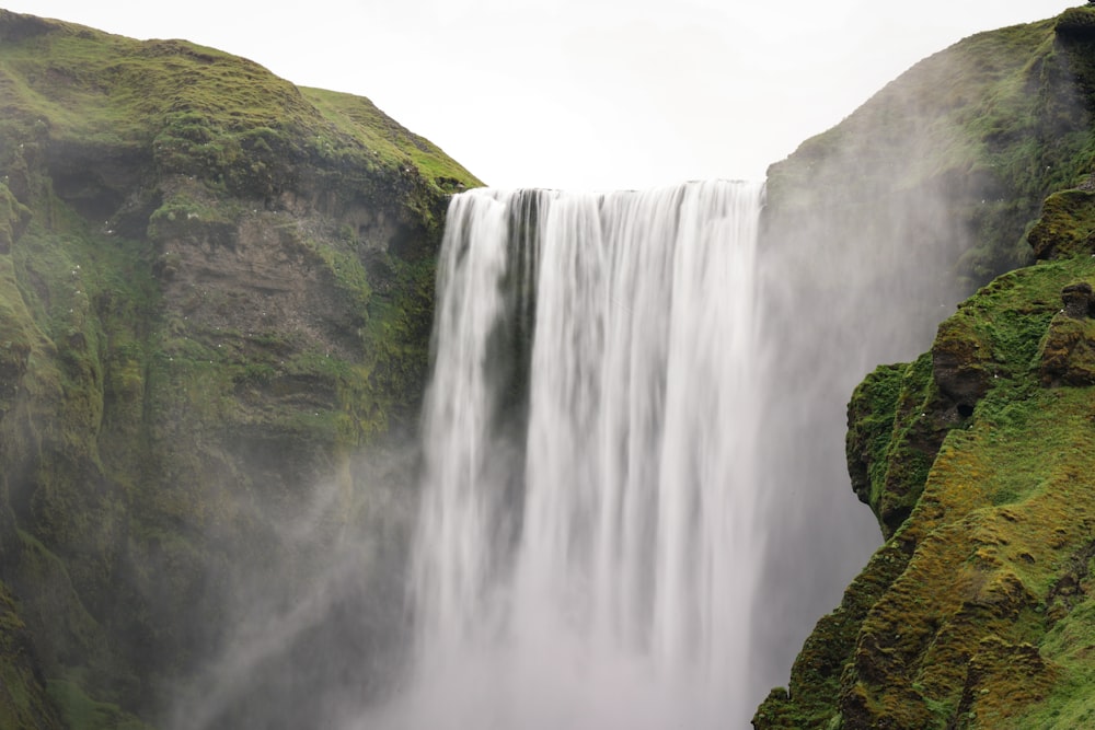 a very tall waterfall with lots of water