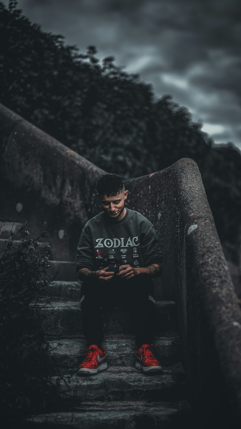 a man sitting on a set of stairs