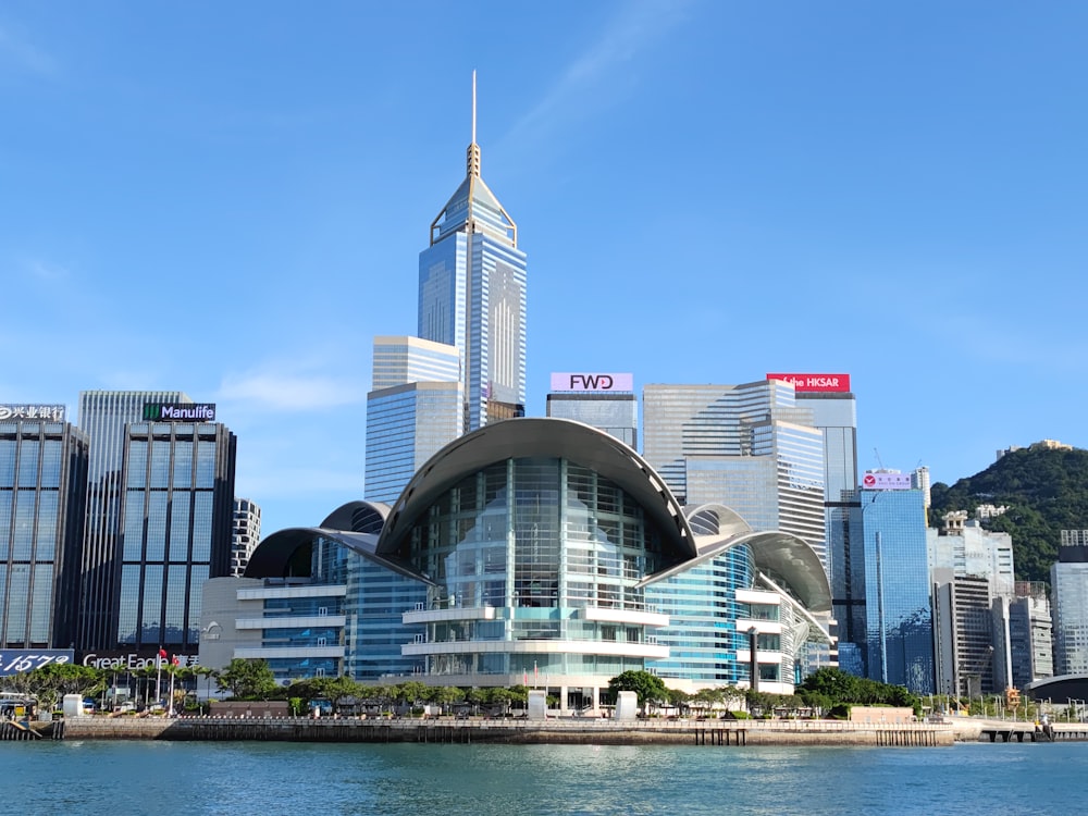 a very tall building sitting in the middle of a body of water