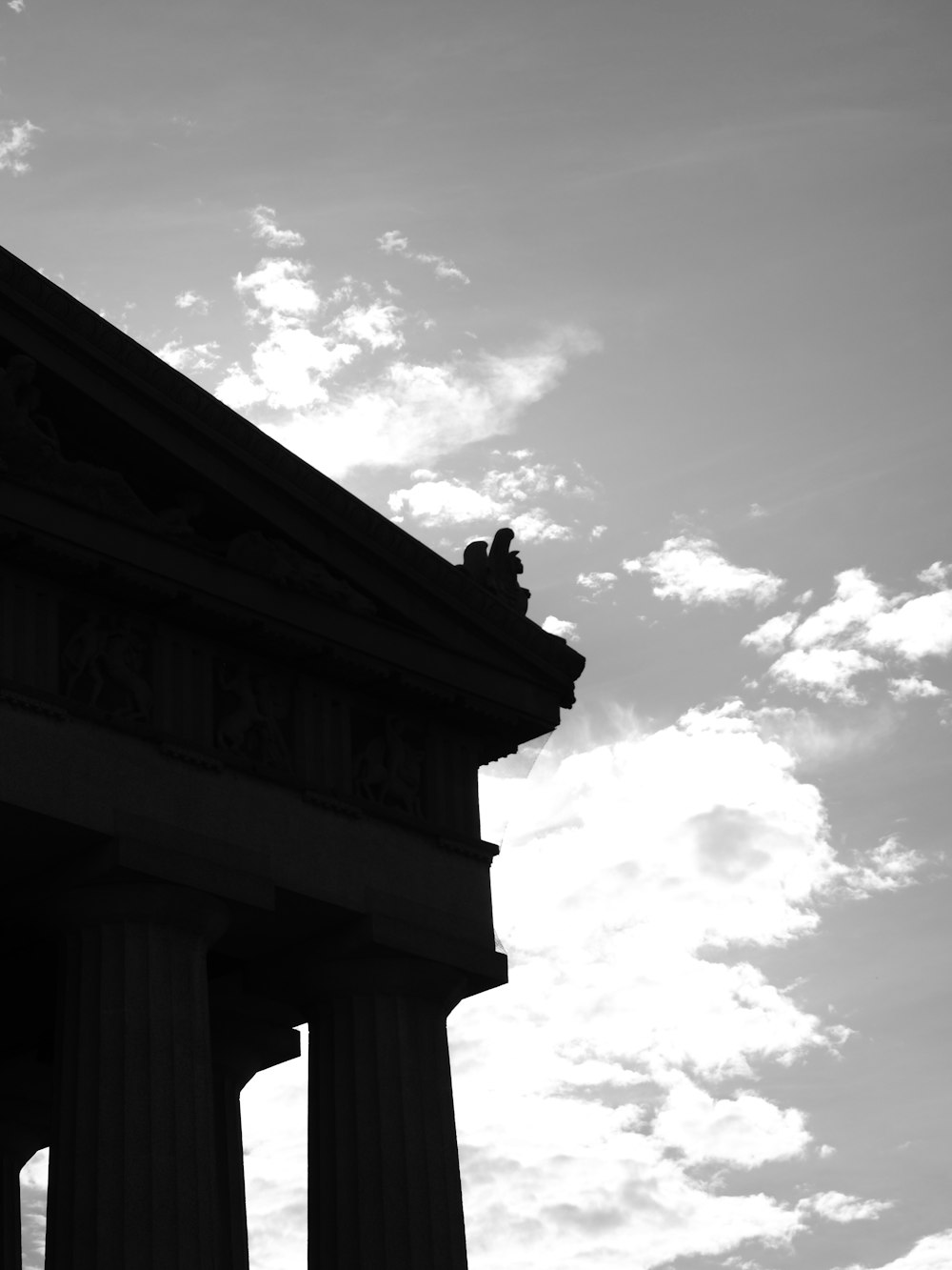 a black and white photo of the top of a building