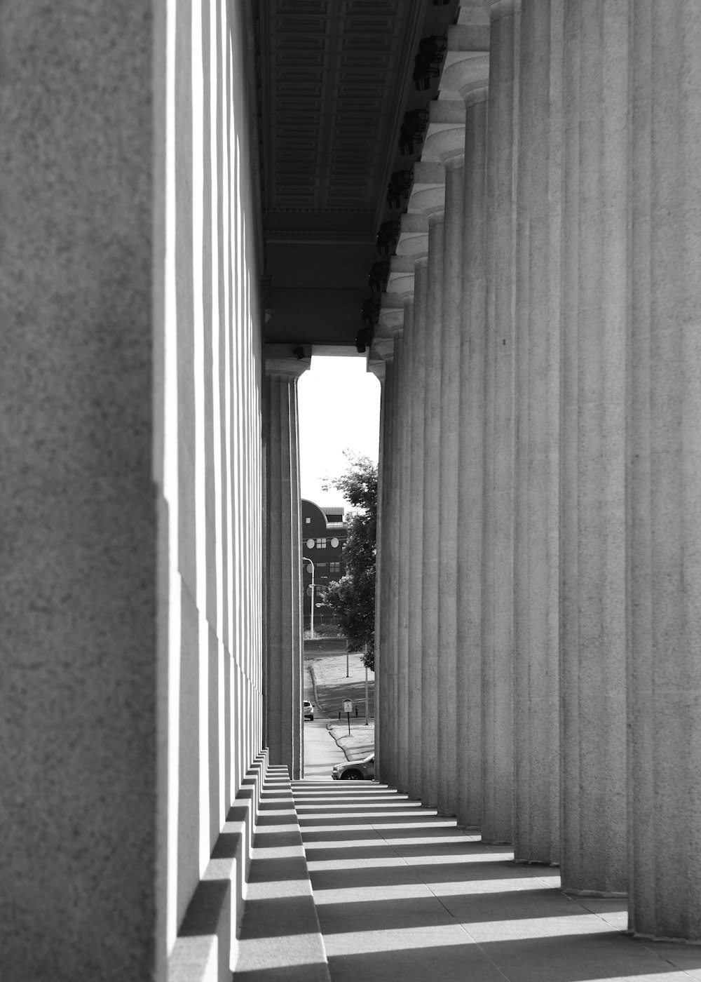 a long line of columns on the side of a building