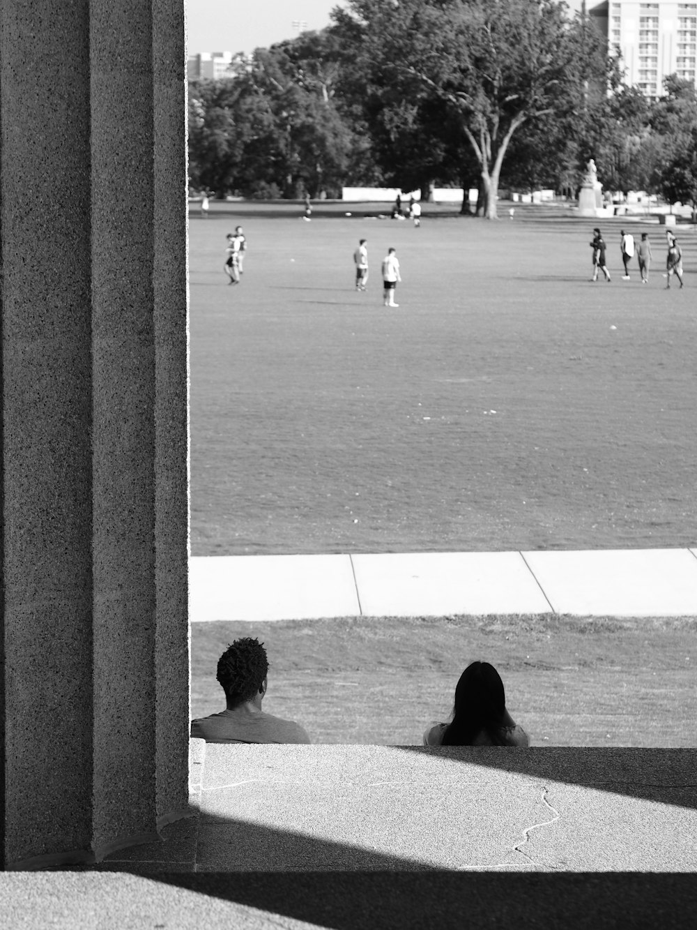 a couple of people that are sitting on the ground