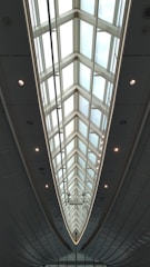 A sleek office ceiling featuring custom architectural panels with integrated lighting.