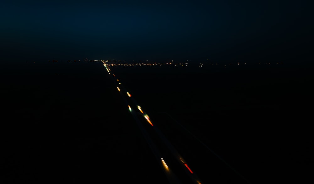 a highway at night with a lot of lights on it