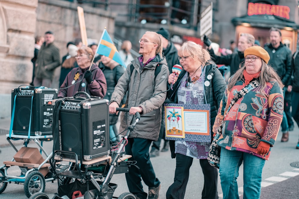 a group of people walking down a street