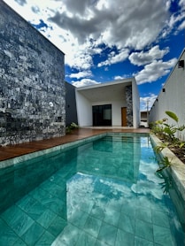 a large swimming pool next to a building