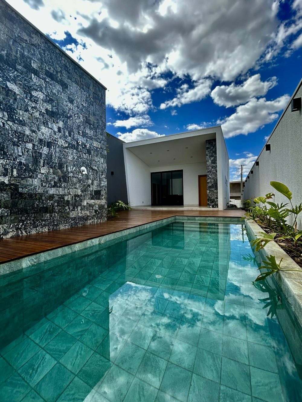 a large swimming pool next to a building