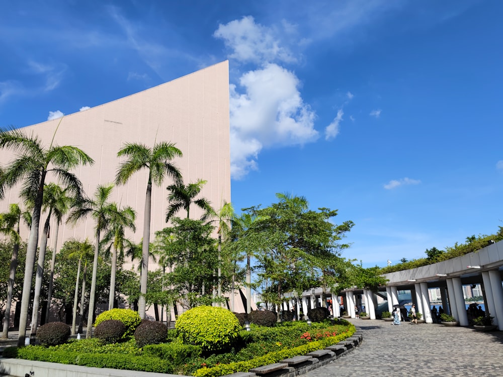 a building with palm trees in front of it