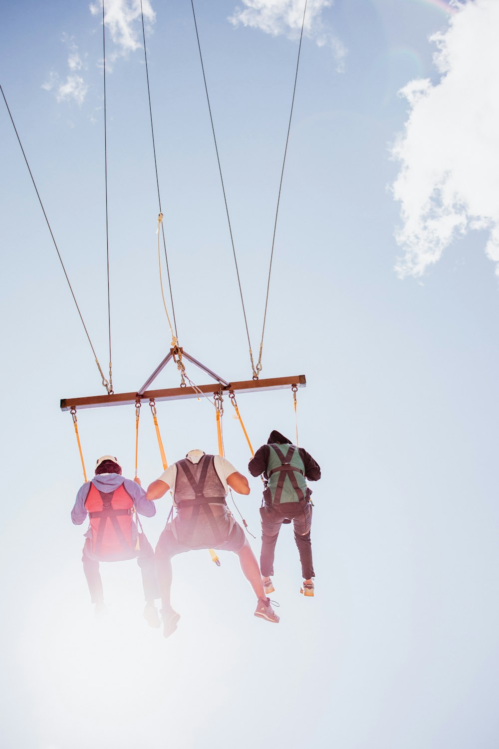 a couple of people riding a ski lift