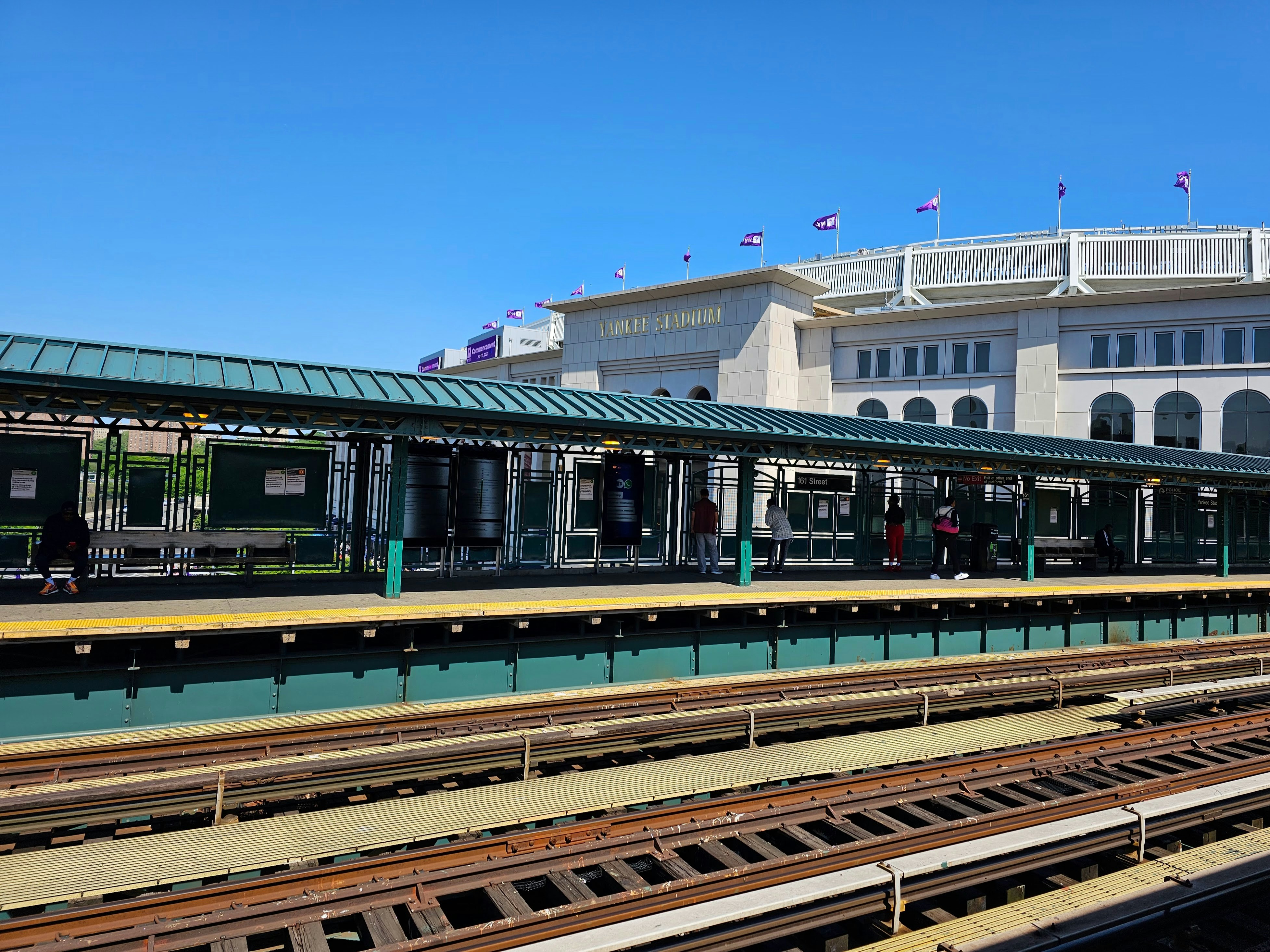 a train station with a train on the tracks
