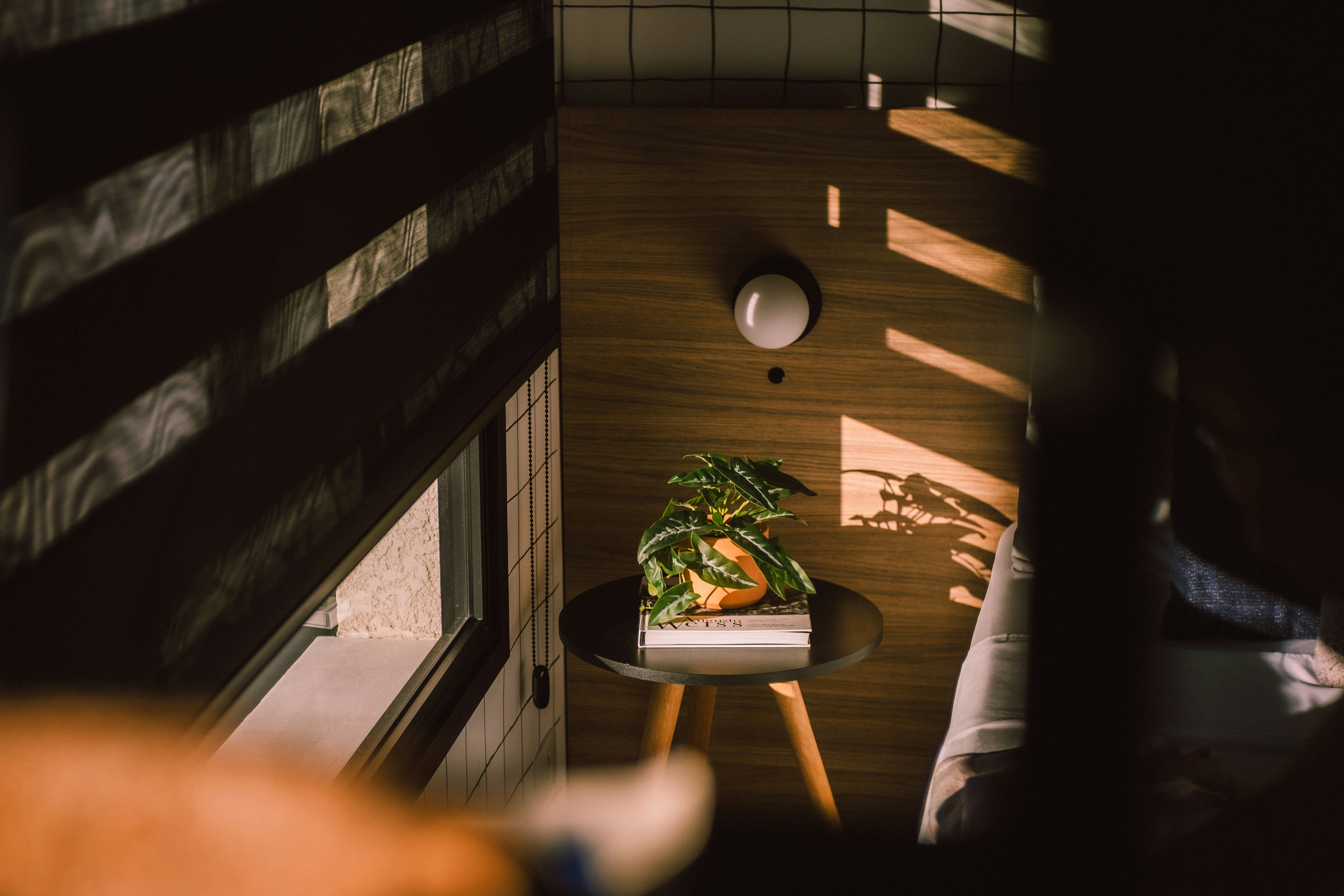 a small table with a potted plant on top of it