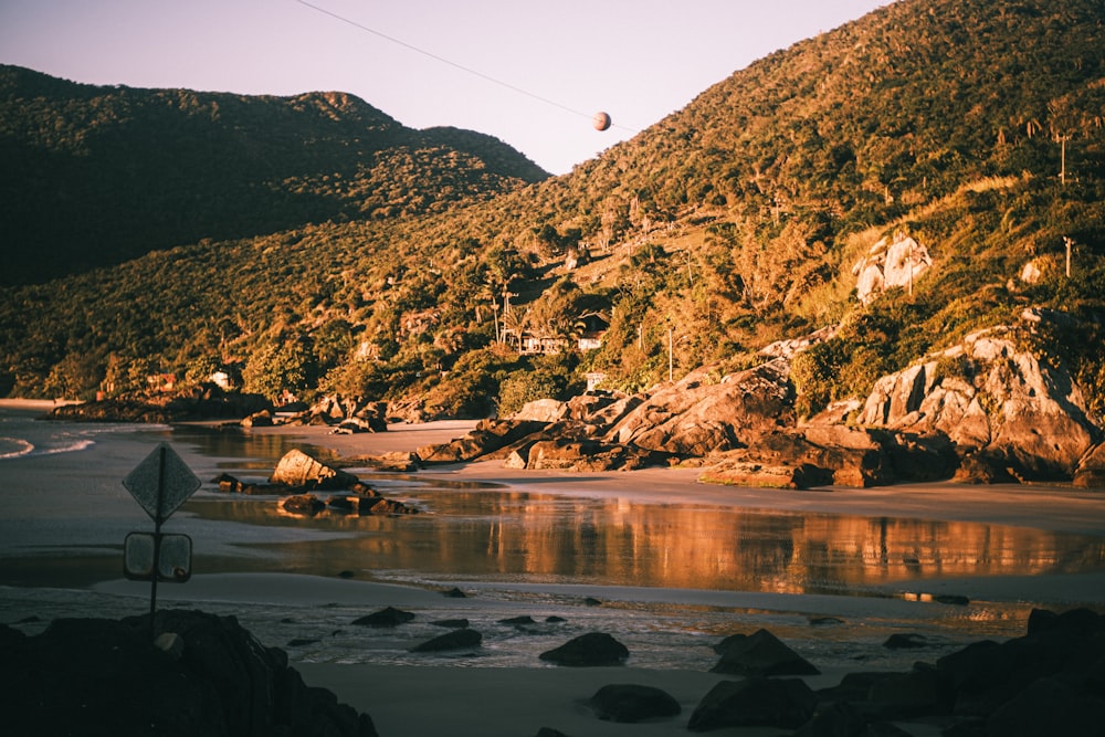 a view of a beach with a mountain in the background