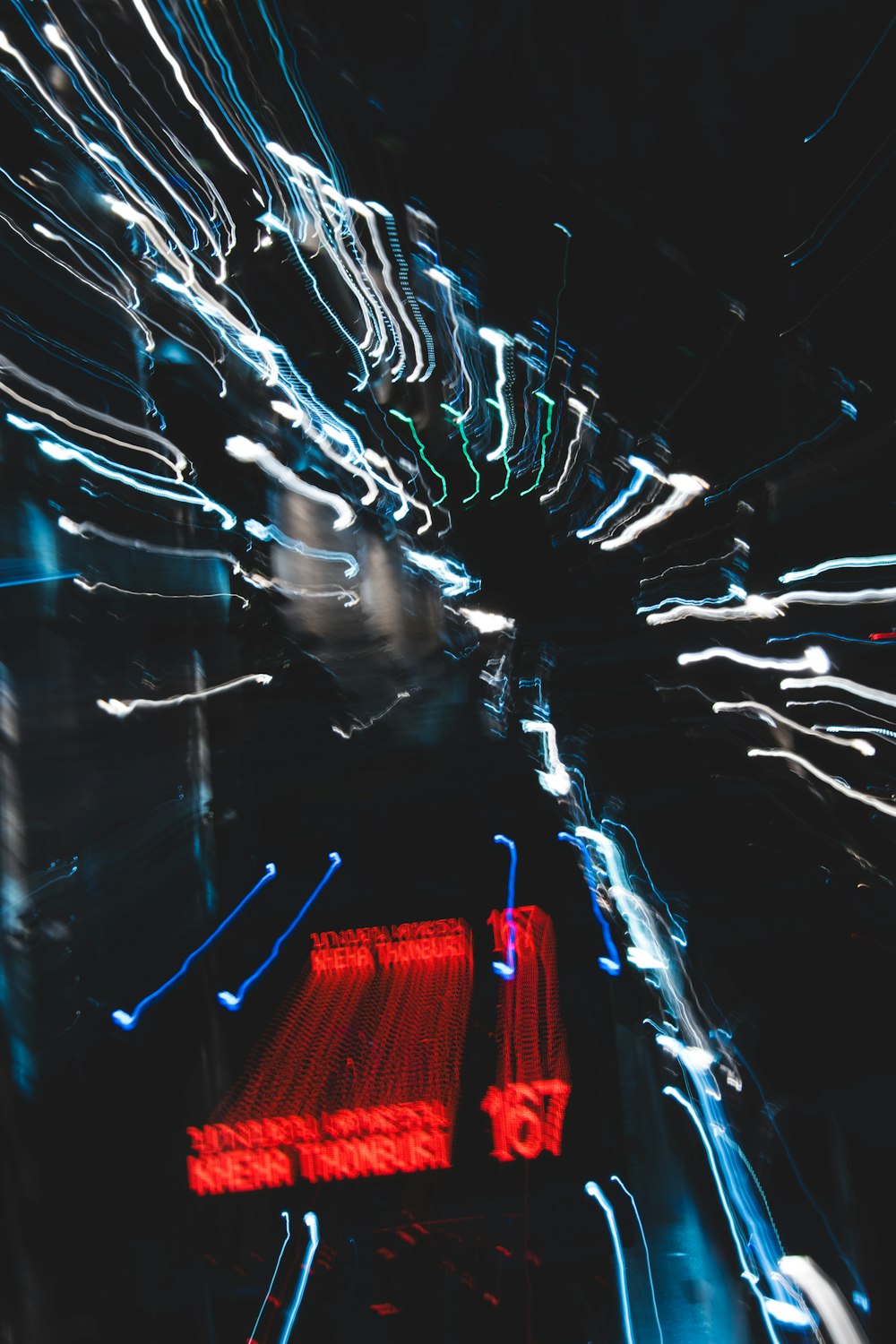 a blurry photo of a city street at night