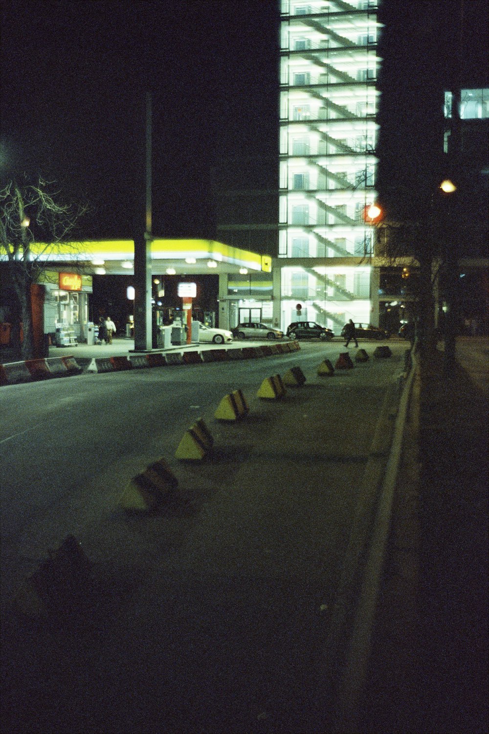 a gas station is lit up at night