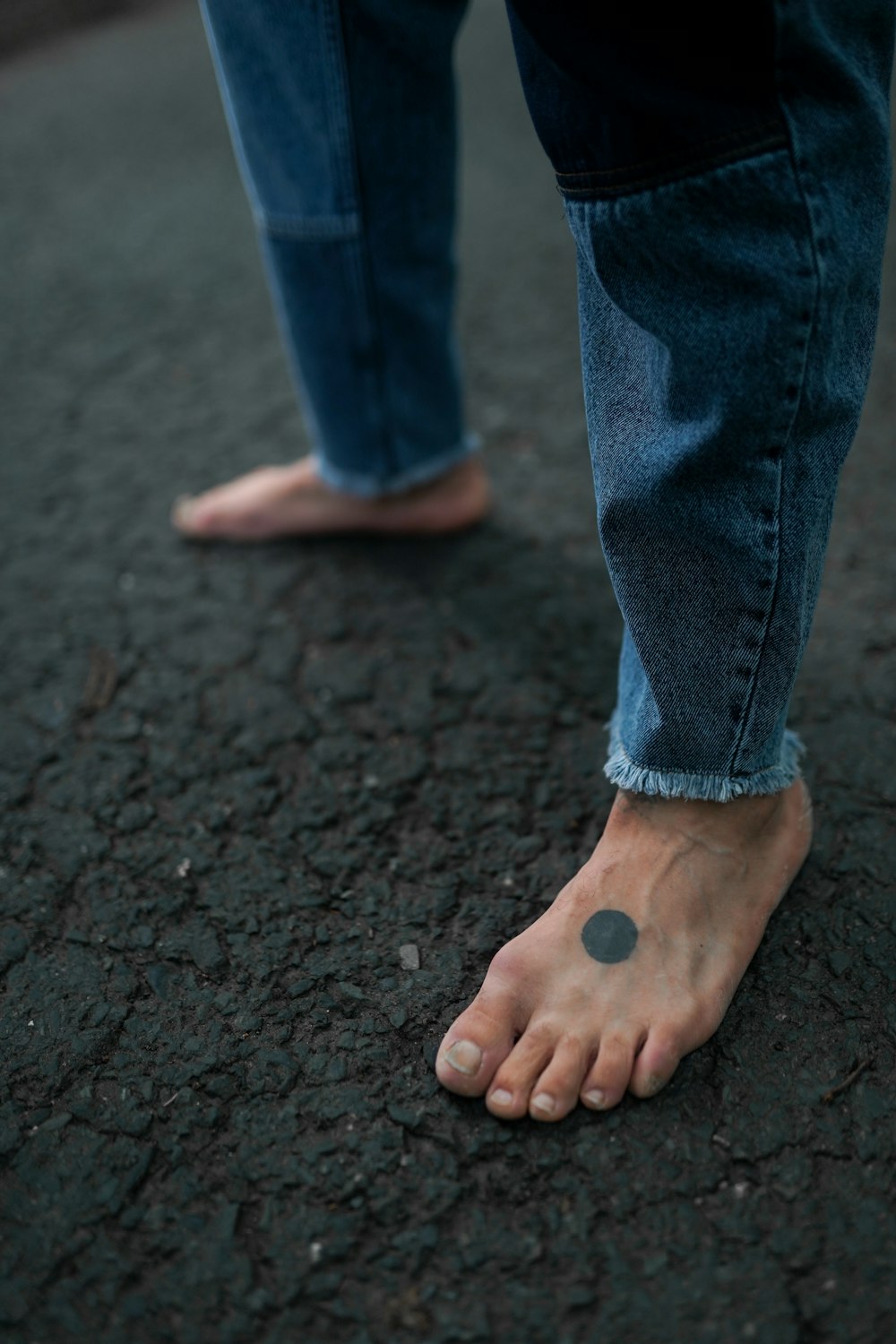 a person's foot with a small dot on it