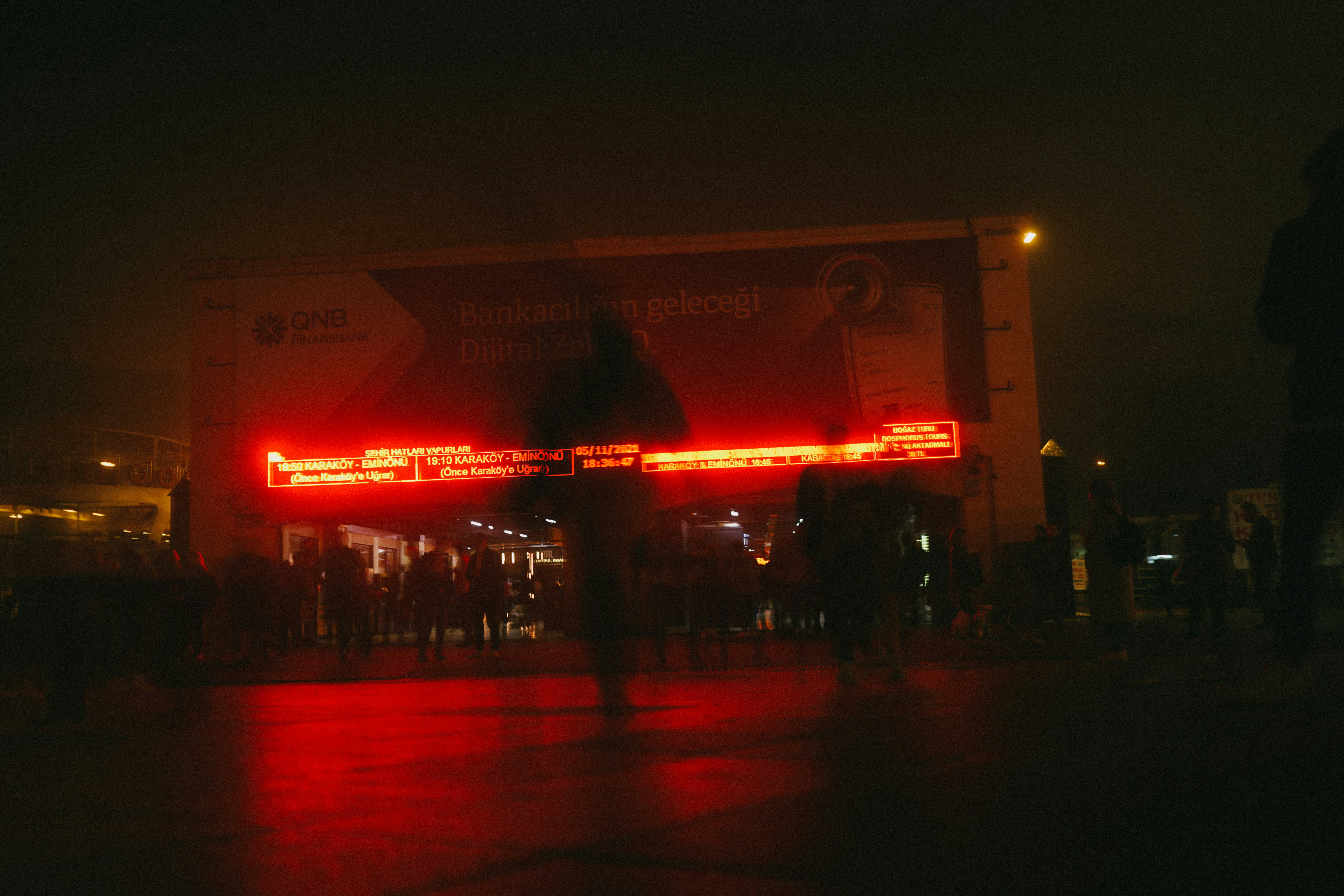 The iconic Aragon Ballroom marquee lit up at night, with people walking by on the street - 3 bedroom apartments uptown chicago