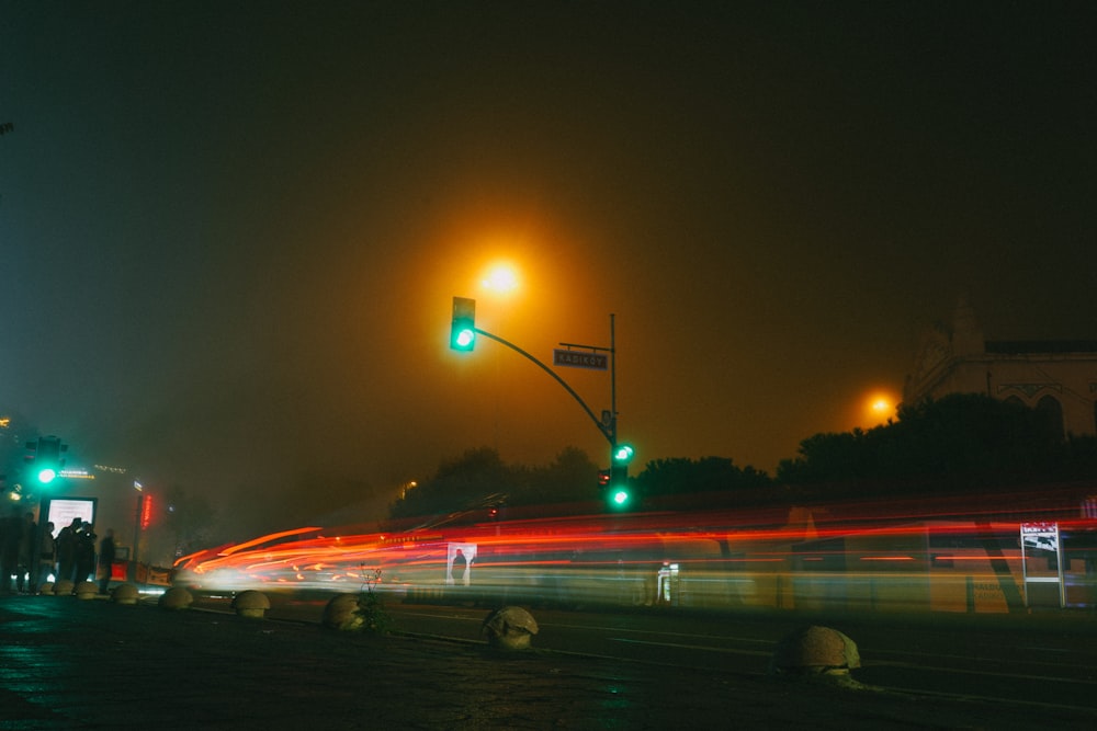 a blurry photo of a city street at night