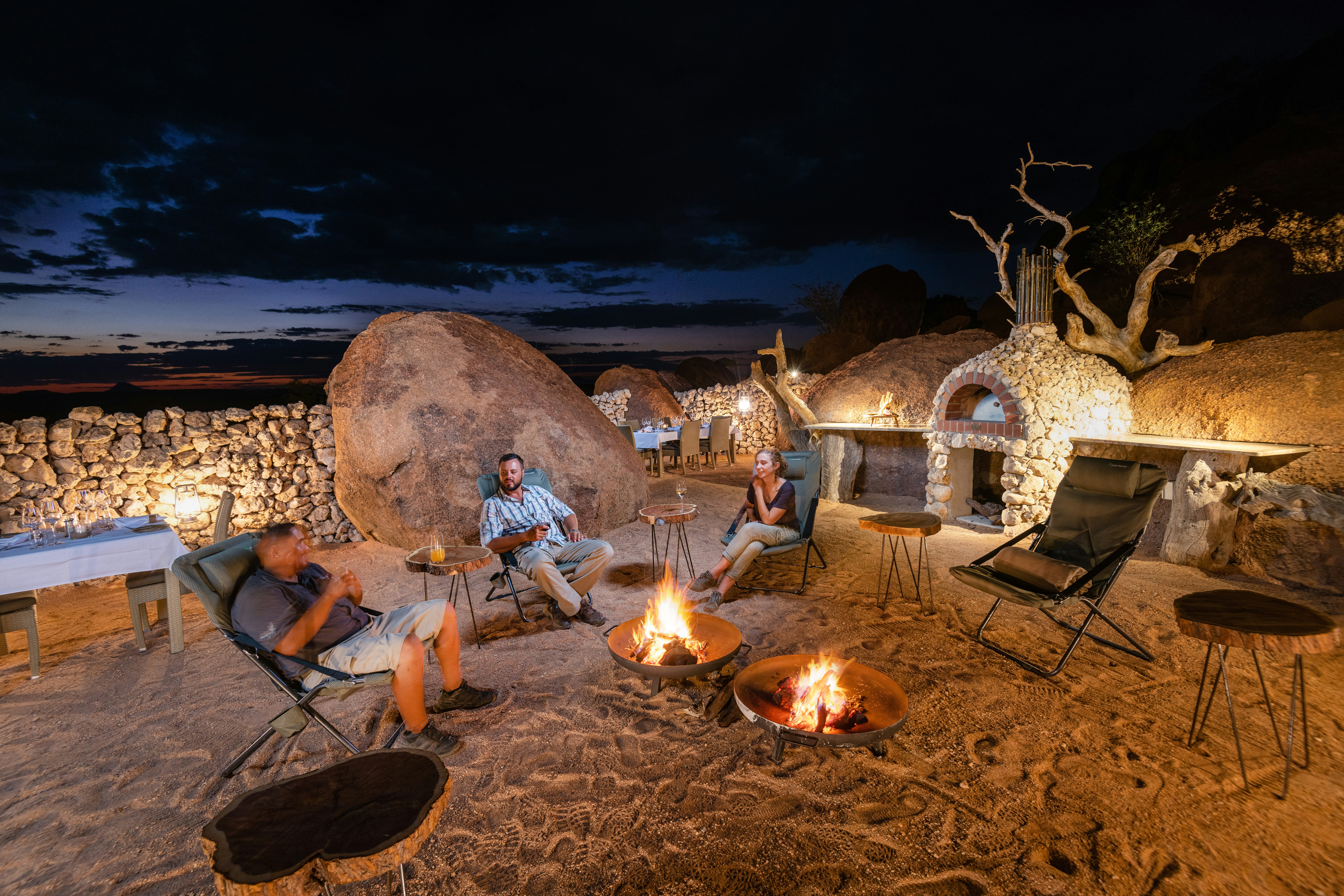 Bush dinner with campfire at a Namibia safari lodge — grilled game and vegetarian options available