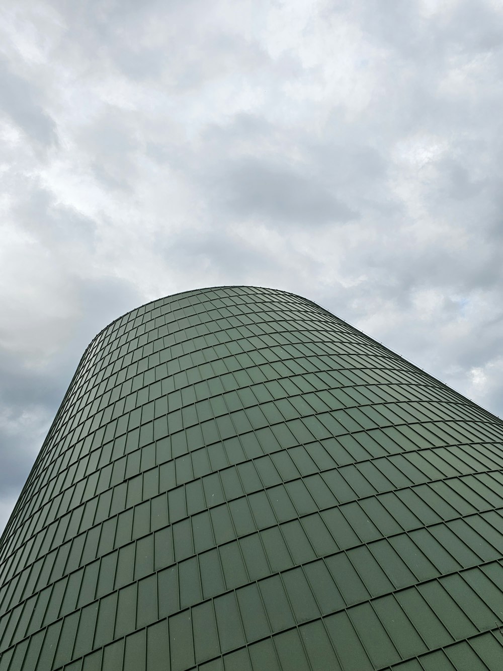 a very tall building with a sky background