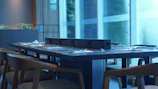 Modern wooden dining table set beautifully arranged in a bright room.