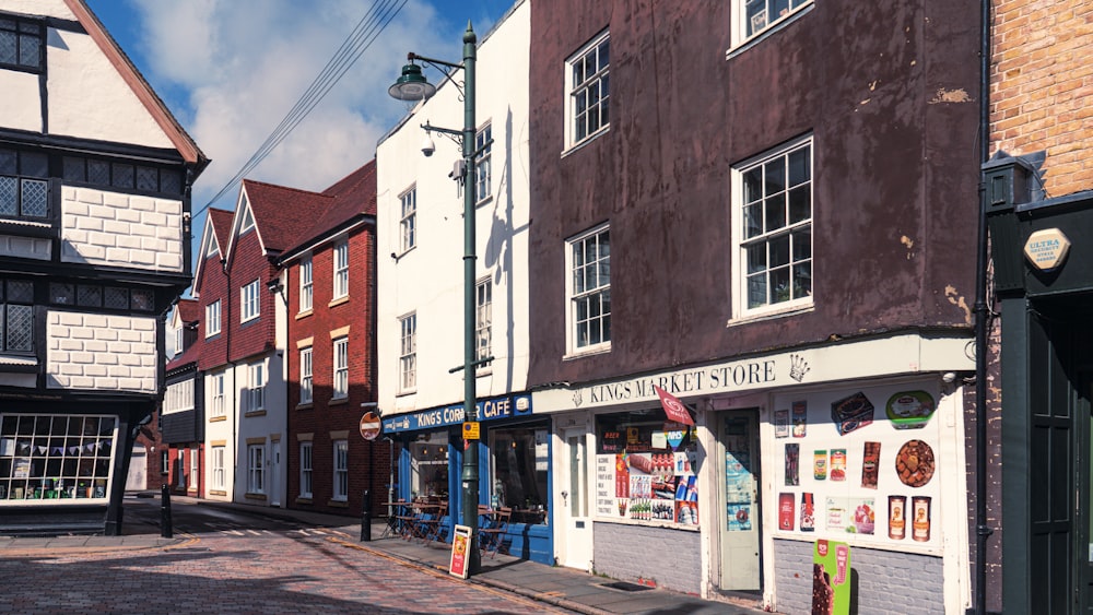 a row of buildings sitting next to each other on a street