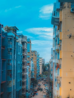 Vibrant street view of a bustling Karachi neighborhood with a mix of residential buildings.