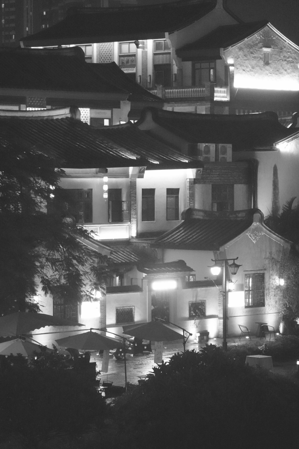 a black and white photo of a building at night