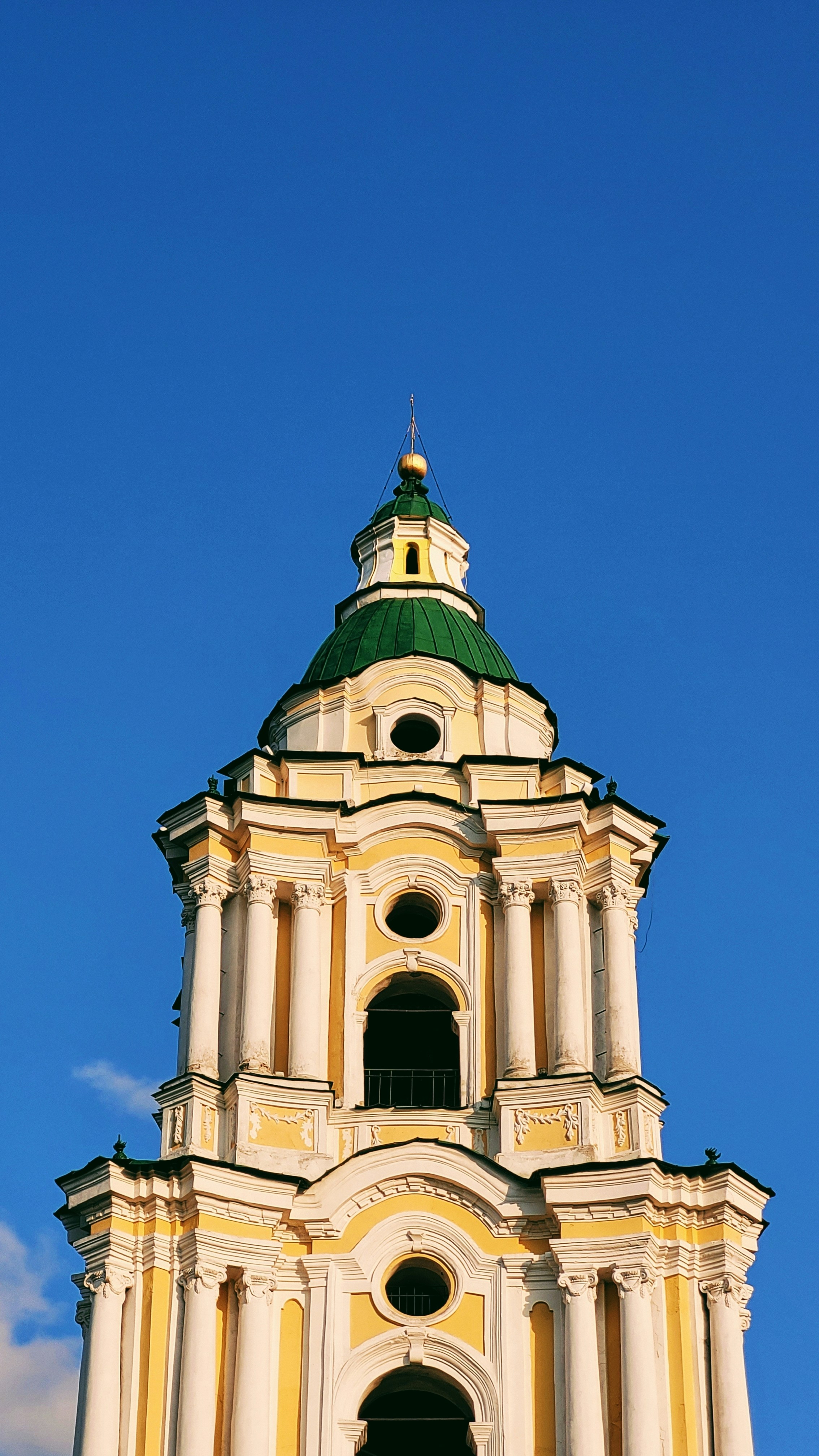 a tall tower with a clock on the top of it